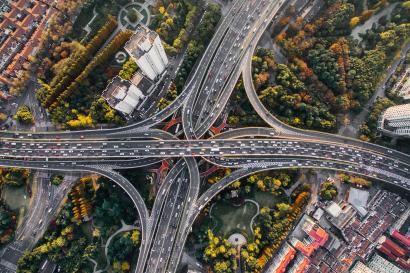 Aerial view of massive interchange in Shanghai, China surrounded by autumn foliage