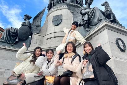 Standing with a friend in front of a statue of Daniel O'Connell