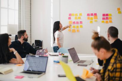 An intern makes a presentation to colleagues at her work experience placement.