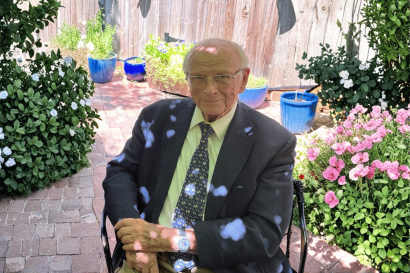 Dr. David M Gray in patio (AI-gen background).