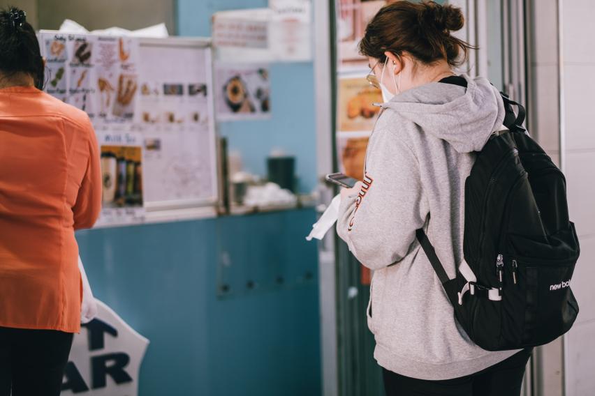 Student wearing backpack and face mask