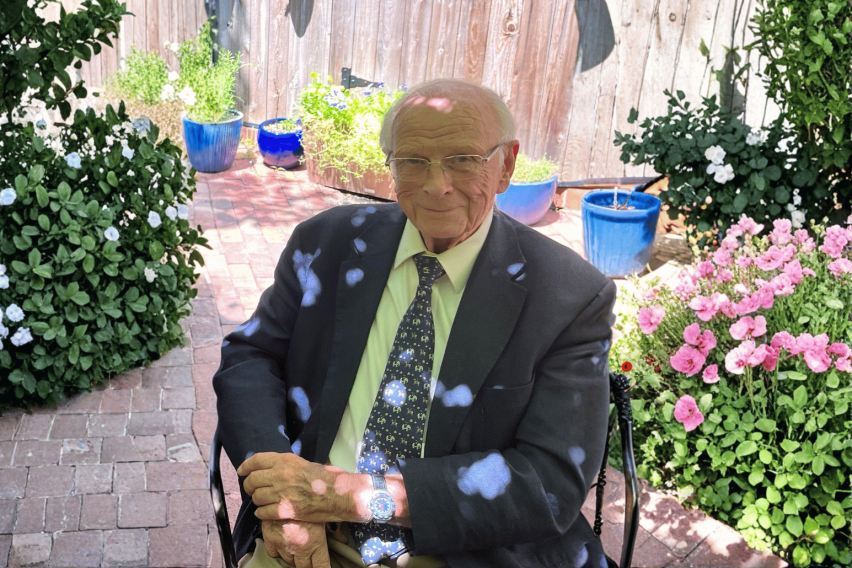 Dr. David M Gray in patio (AI-gen background).
