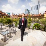 a business student walking in Milan