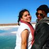 two students stand arm-in-arm in front of lagoons in San Pedro de Atacama, Chile