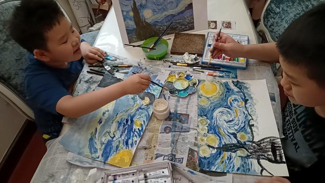 Staff member Gorden Xie's two boys painting Van Gogh's Starry Night together.