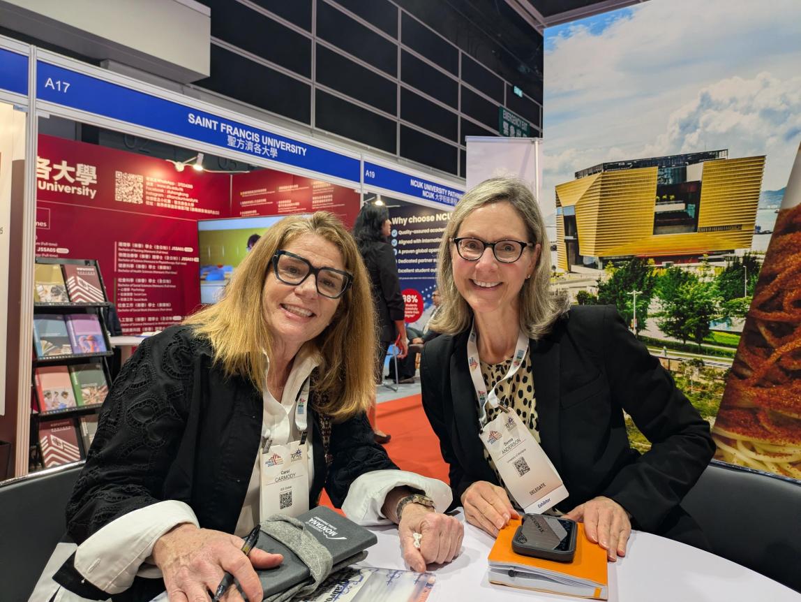 Carol Carmody with a partner from University of Montana at APAIE 2026.