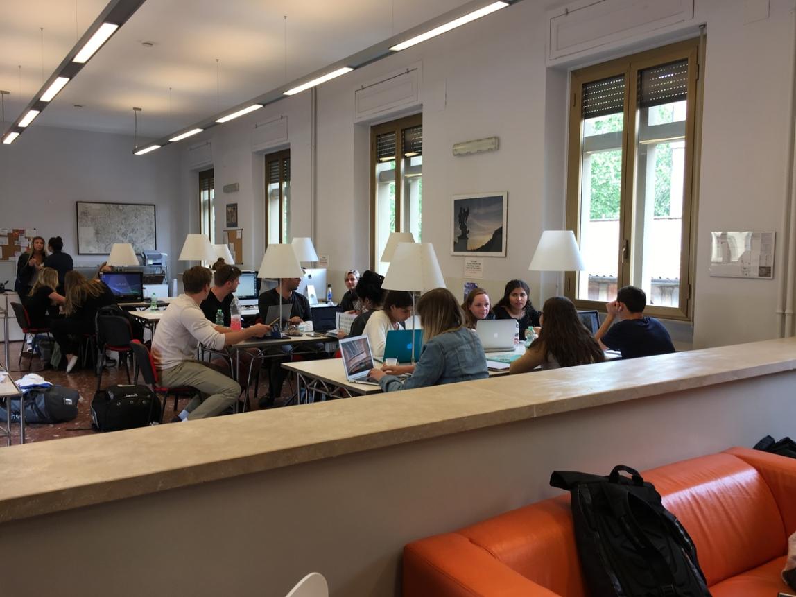 Many students working in the hub at the IES Abroad Rome Center.