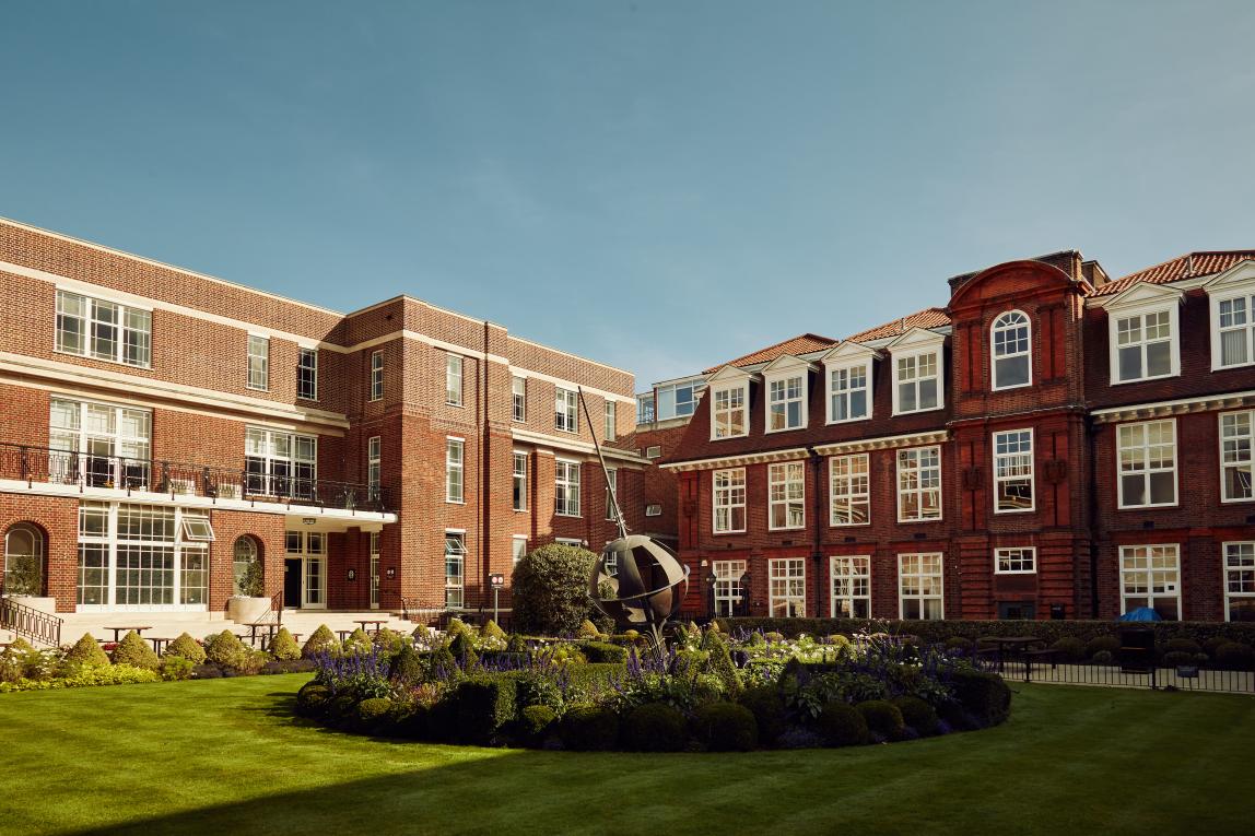 Courtyard of Regent's University London, globe sculpture and garden in the middle.