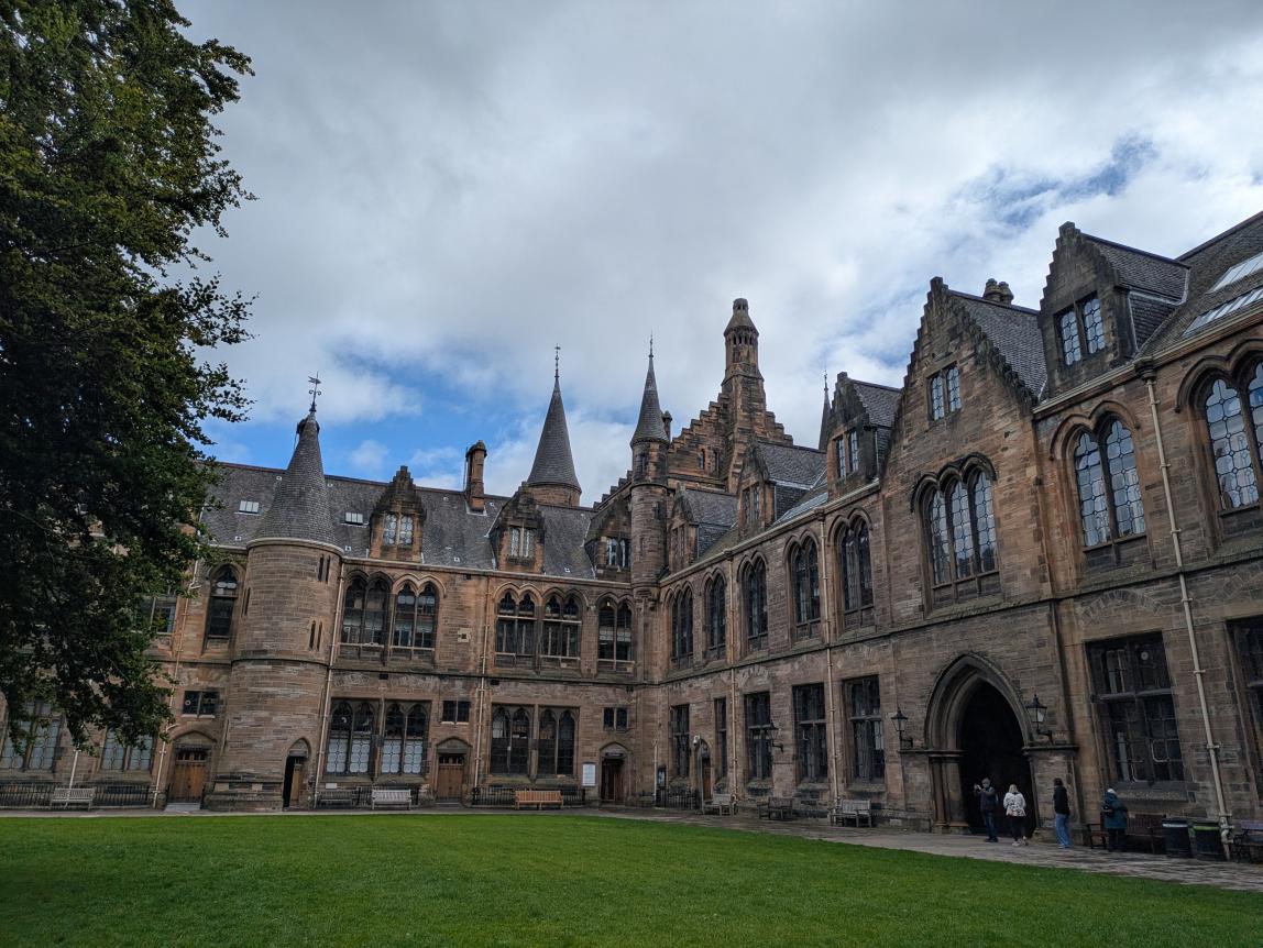 Outside a University of Glasgow building with a clean courtyard.