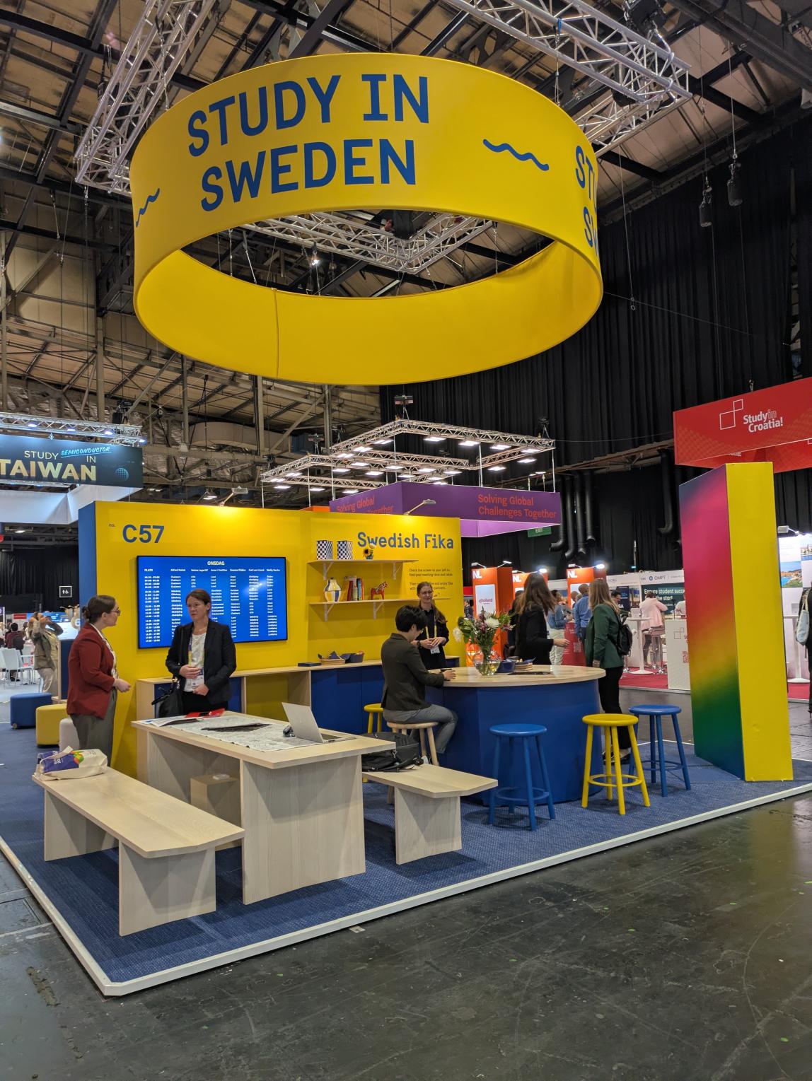 Study in Sweden booth at EAIE 2026, people conversing. 