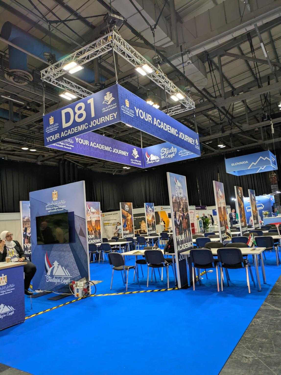 Booth at EAIE 2026 with overhead banner reading "D81 Your Academic Journey" and "Study in Egypt".