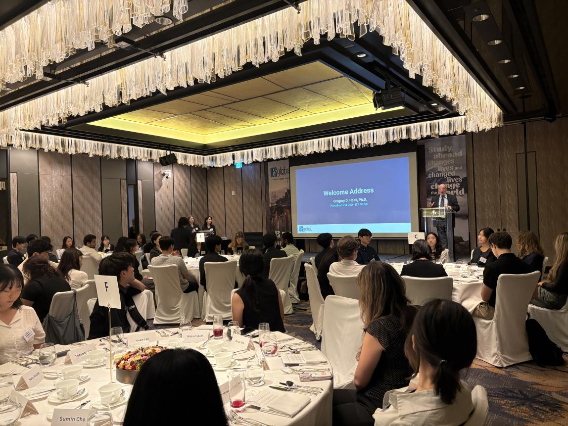 Dr. Greg Hess presenting in front of the crowd at the 2026 SAF Korea Alumni Event.