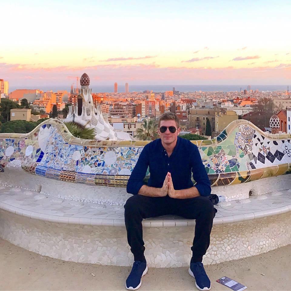 a male student poses for a photo at Park Güell