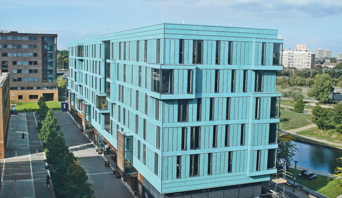 A bright blue building, the France House, sits on the campus of the University of London-Queen Mary.