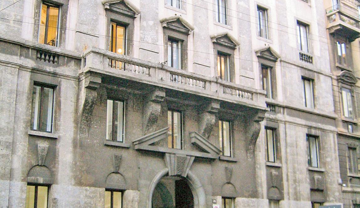 Exterior view of the Milan Center, a grey brick building