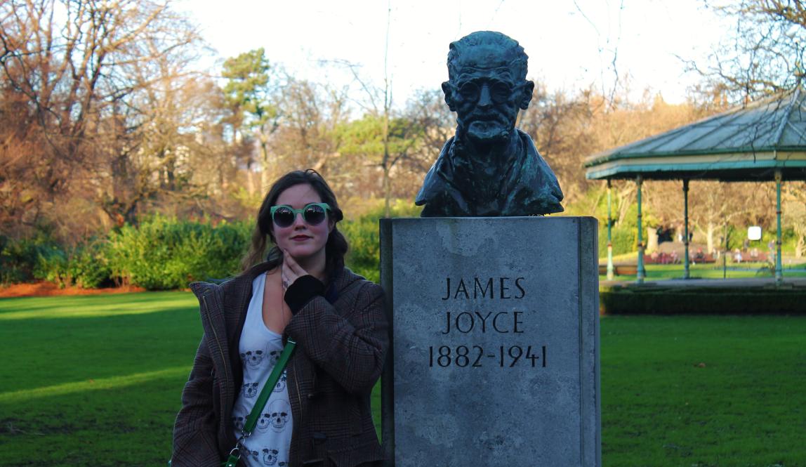 A student posing with a James Joyce statue in Dublin