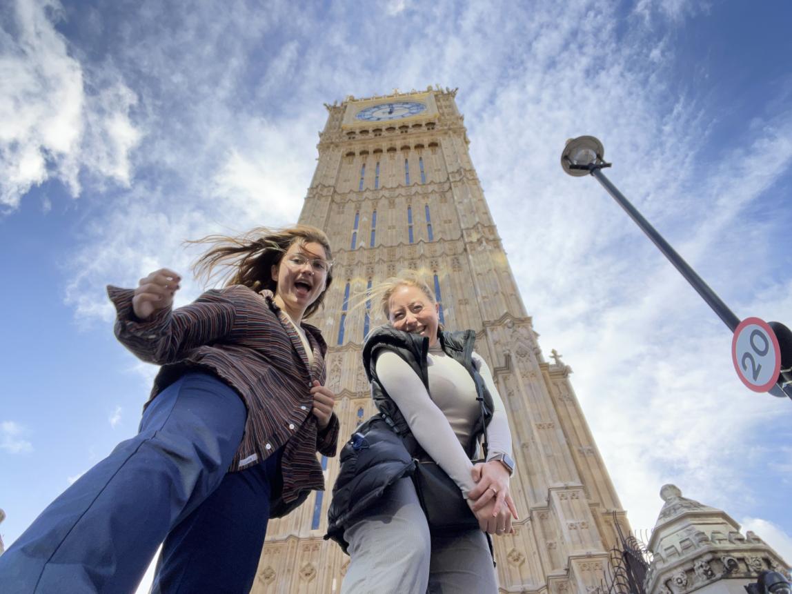 Two students smile in front of Big Ben.