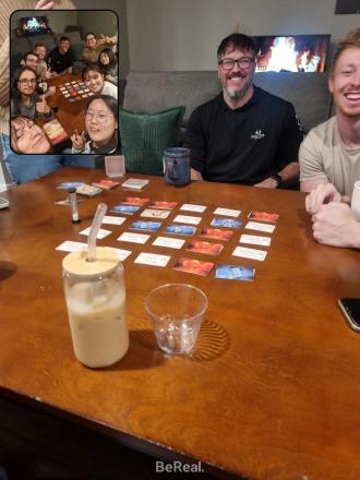 A group of students play a board game