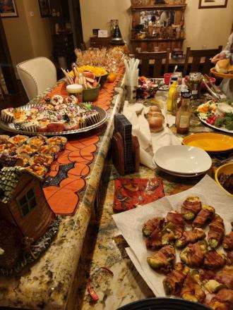 A plate of treats is laid out for a halloween themed party