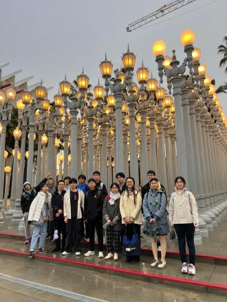 UCLA Big Data & Business Application students pose for a photo at the Urban Light sculpture on Wilshire Boulvevard LA