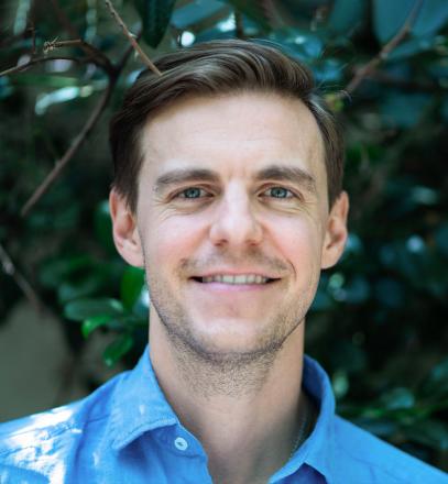 Headshot of Adam Harrison.