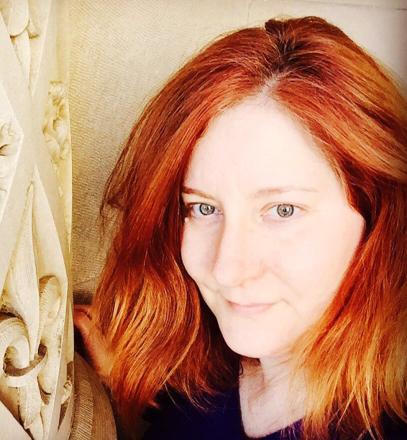 a headshot photo of Sandi