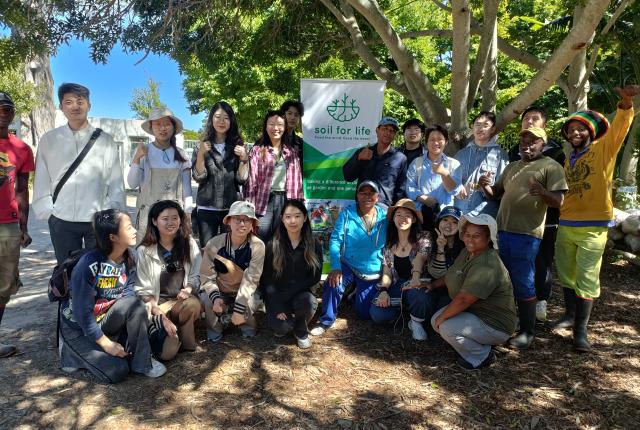 Group photo of SAF students at Soil for Life in Cape Town