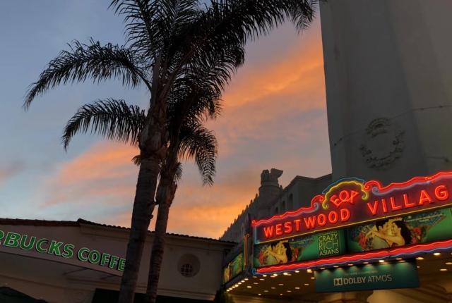 LA Westwood Village neon sign with sunset sky