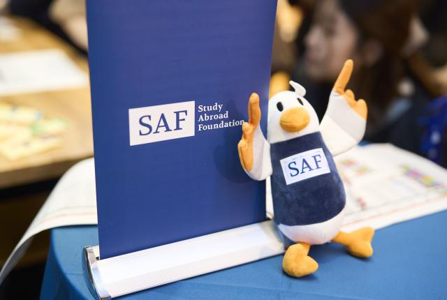 SAFFY plush doll in front of SAF folder.
