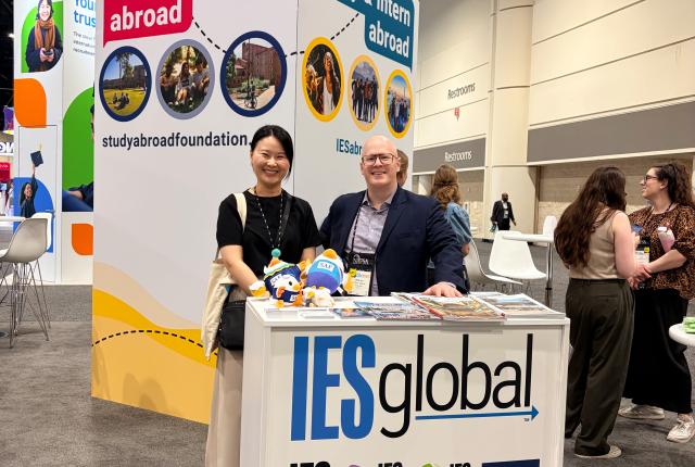 SAF staff at IES Global booth, with the SAF and IES Abroad banners in the background.