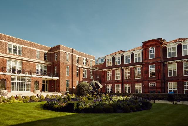 Courtyard of Regent's University London, globe sculpture and garden in the middle.