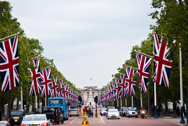 a British flag-lined street leading up to the Victoria Memorial