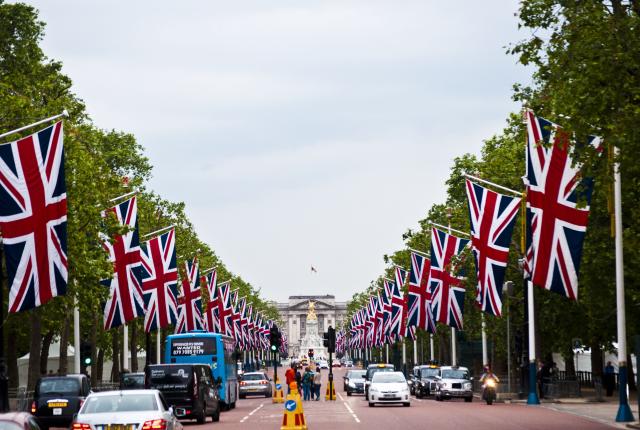 a British flag-lined street leading up to the Victoria Memorial