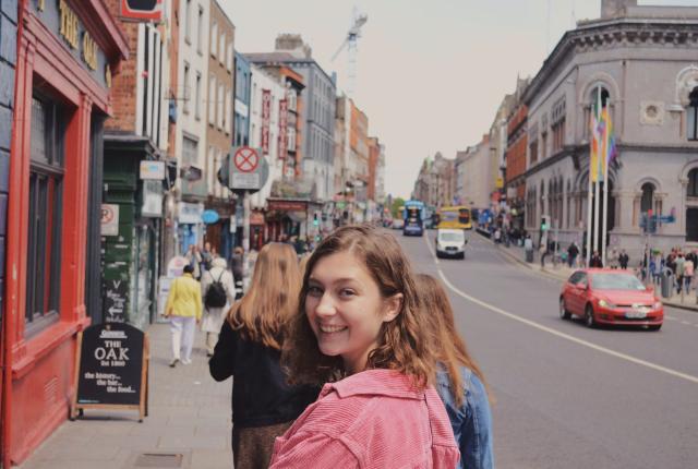 a student in Temple Bar turning around for a fun photo