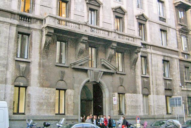 Exterior view of the Milan Center, a grey brick building