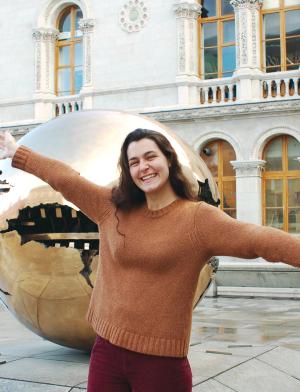 dublin student poses for a photo in front of Trinity College Dublin
