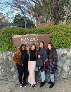 students pose for a photo in front of the Nanzan University sign in Nagoya
