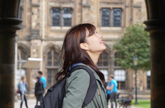 Girl Standing in Arch