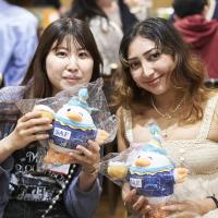 SAF Alumni Event - Students holding 25th SAFFY