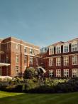 Courtyard of Regent's University London, globe sculpture and garden in the middle.