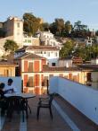 Students sit at a table on the rooftop of the IES Abroad Granada center.