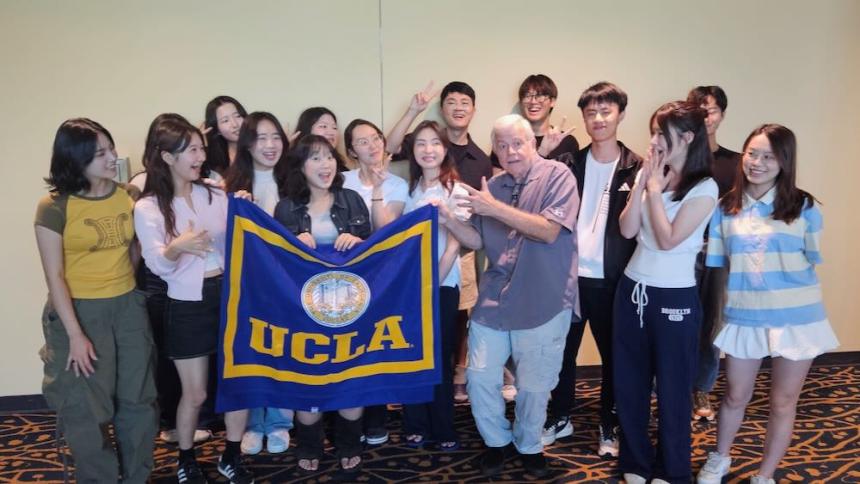 UCLA Extension Study Tour Certificate Ceremony (2025) - group photo of students holding flag
