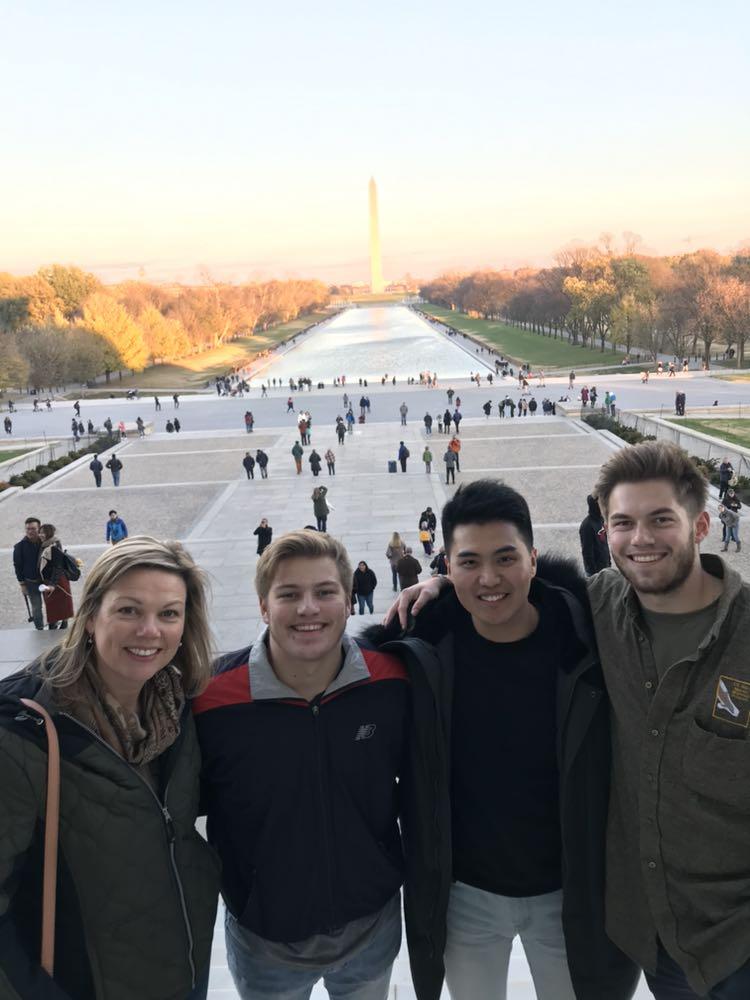 SAF student Kihwan Kim poses with study abroad friends at the Washington Monument while on exchange