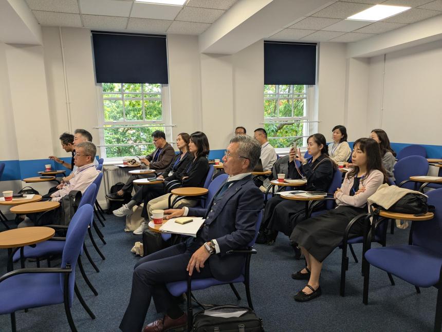 Professionals sitting in classroom, listening to presentation at IES Abroad London Center.