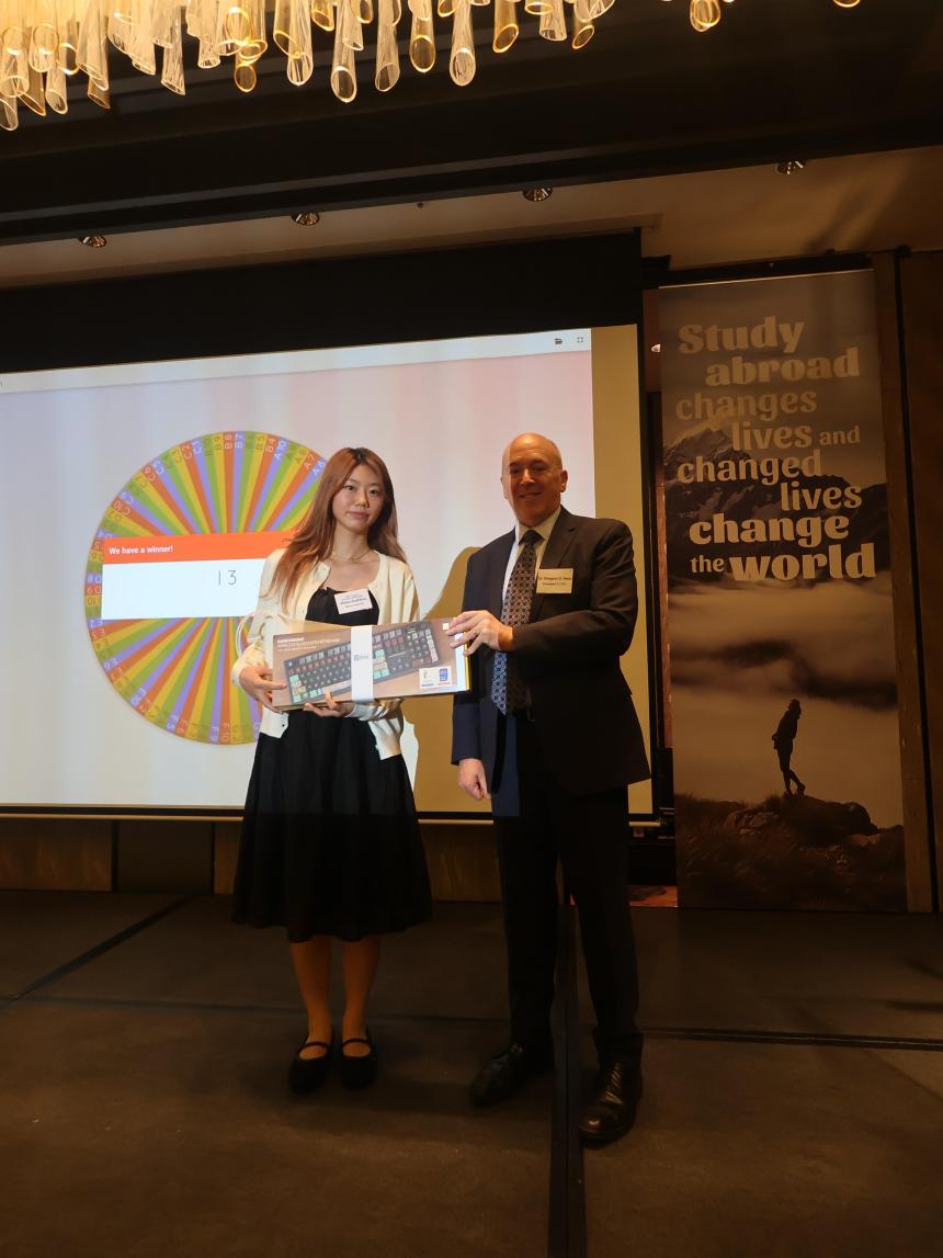 Dr. Greg Hess presenting a student with a keyboard prize at the 2026 SAF Korea Alumni Event.