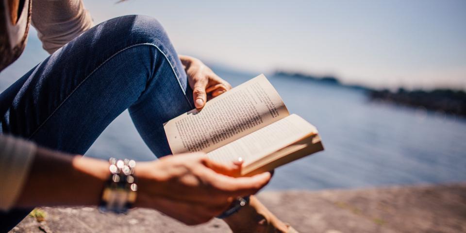 Woman outside reading a book