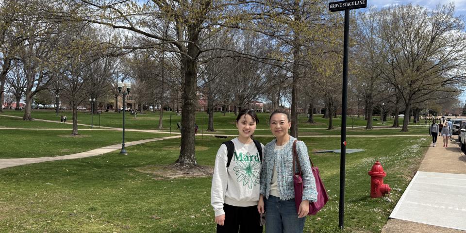 Lucia You and an SAF student meet on campus at University of Mississippi